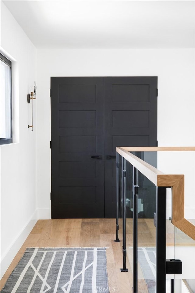 19476 Woodlands Dr, Huntington Beach, CA 92648 - hall featuring light wood-type flooring and baseboards