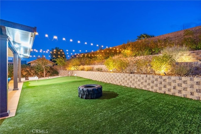 7116 W W Ave L4, Lancaster, CA 93536 - fenced backyard with a putting green