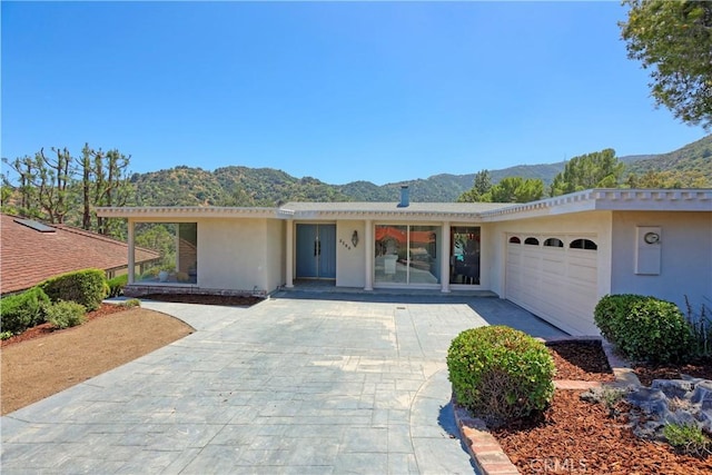 3260 Beaudry, Glendale, CA 91208 - ranch-style house with a mountain view, stucco siding, and decorative driveway