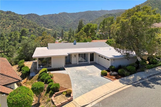 3260 Beaudry, Glendale, CA 91208 - ranch-style home with driveway, stucco siding, a mountain view, and a garage