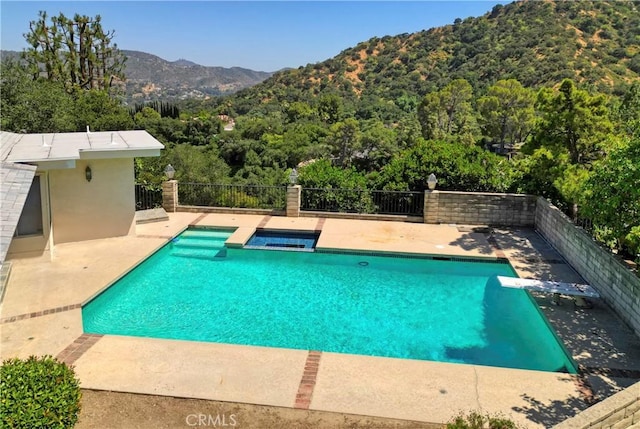 3260 Beaudry, Glendale, CA 91208 - view of pool featuring a mountain view, a patio, a pool with connected hot tub, a diving board, and a forest view