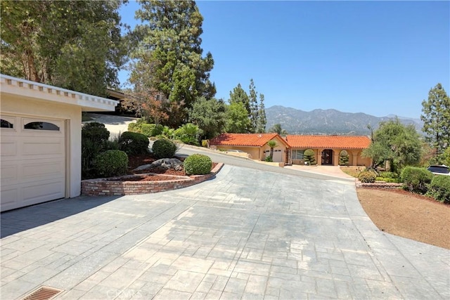 3260 Beaudry, Glendale, CA 91208 - view of front of property with a mountain view, a tiled roof, driveway, a garage, and stucco siding