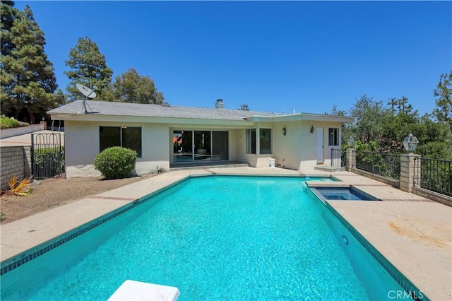 3260 Beaudry, Glendale, CA 91208 - rear view of house featuring stucco siding, a patio area, a pool with connected hot tub, and a gate