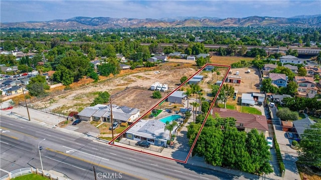 4759 Cochran St, Simi Valley, CA 93063 - aerial perspective of suburban area featuring property boundaries highlighted and a mountainous background