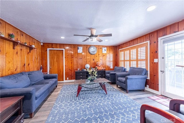4759 Cochran St, Simi Valley, CA 93063 - living room featuring a ceiling fan, wooden walls, recessed lighting, and light wood-style floors