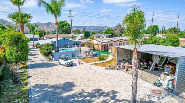4759 Cochran St, Simi Valley, CA 93063 - view of yard with a mountain view, a carport, and driveway