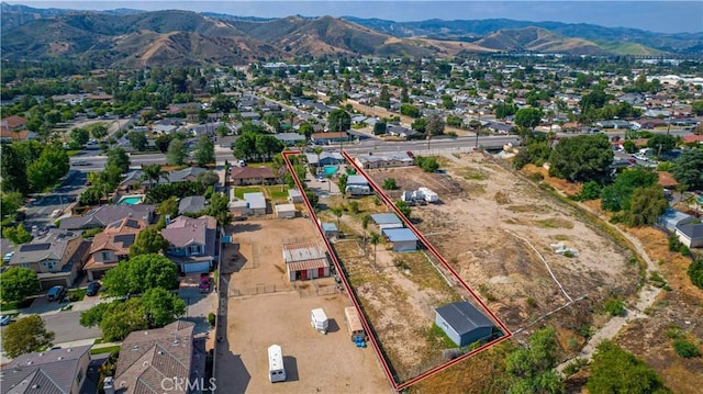 4759 Cochran St, Simi Valley, CA 93063 - aerial view of residential area featuring a mountain backdrop and property parcel outlined