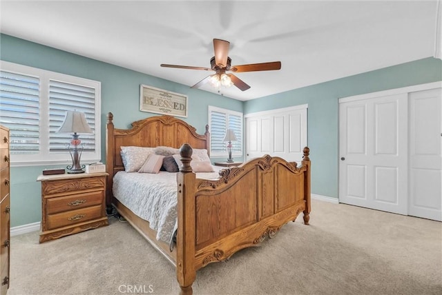 1160 Baseline Rd, La Verne, CA 91750 - bedroom with light carpet, multiple windows, multiple closets, and ceiling fan