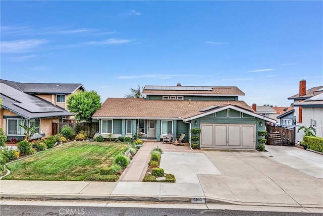 1160 Baseline Rd, La Verne, CA 91750 - view of front facade with a garage, solar panels, driveway, a porch, and a gate
