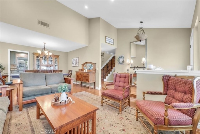 1160 Baseline Rd, La Verne, CA 91750 - living room featuring a chandelier, high vaulted ceiling, light wood finished floors, and recessed lighting