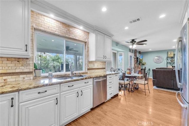 1160 Baseline Rd, La Verne, CA 91750 - kitchen featuring appliances with stainless steel finishes, a ceiling fan, decorative backsplash, white cabinets, and recessed lighting