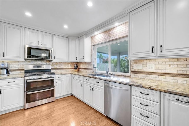 1160 Baseline Rd, La Verne, CA 91750 - kitchen featuring stainless steel appliances, white cabinetry, decorative backsplash, and recessed lighting