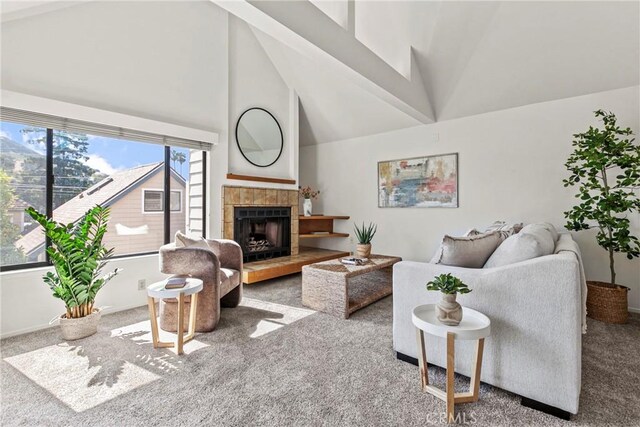 777 Chorro St Unit 3, San Luis Obispo, CA 93401 - carpeted living room featuring a fireplace and high vaulted ceiling