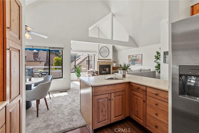 777 Chorro St Unit 3, San Luis Obispo, CA 93401 - kitchen featuring stainless steel fridge with ice dispenser, a fireplace, open floor plan, light countertops, and vaulted ceiling