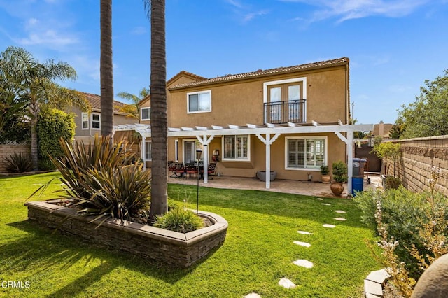 2561 Upper Bay Dr, Oxnard, CA 93036 - back of property with a pergola, a balcony, stucco siding, and a fenced backyard