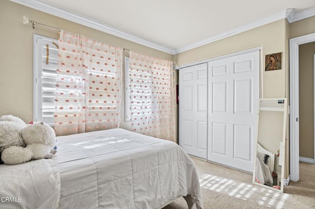 2561 Upper Bay Dr, Oxnard, CA 93036 - bedroom with ornamental molding, carpet floors, and a closet