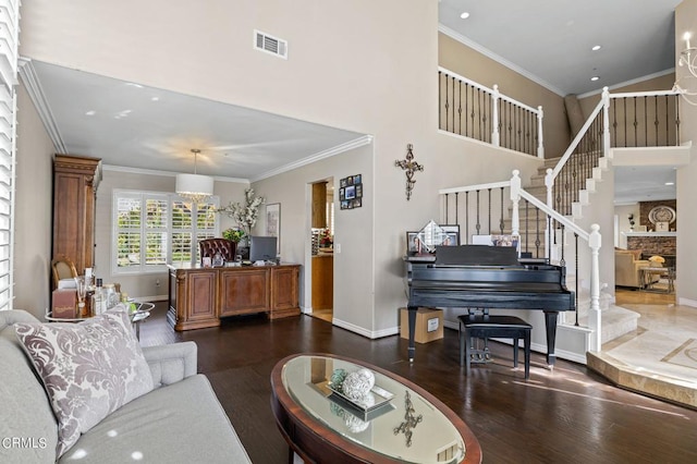 2561 Upper Bay Dr, Oxnard, CA 93036 - living room with wood finished floors, stairs, ornamental molding, recessed lighting, and a towering ceiling