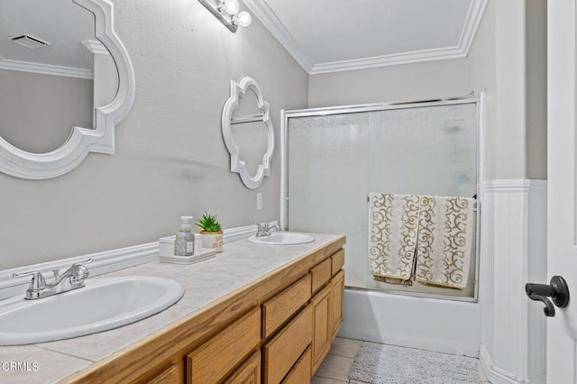 2561 Upper Bay Dr, Oxnard, CA 93036 - full bath with crown molding, combined bath / shower with glass door, double vanity, and tile patterned flooring