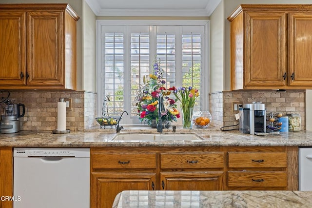 2561 Upper Bay Dr, Oxnard, CA 93036 - kitchen with white dishwasher, brown cabinetry, decorative backsplash, and crown molding