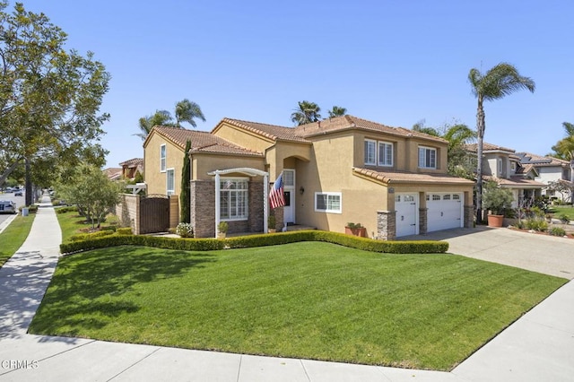 2561 Upper Bay Dr, Oxnard, CA 93036 - mediterranean / spanish house featuring stone siding, stucco siding, driveway, an attached garage, and a tiled roof