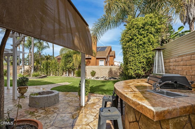 2561 Upper Bay Dr, Oxnard, CA 93036 - view of patio with a fire pit and a grill