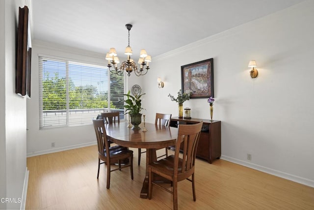 630 S Orange Grove Blvd Unit 5, Pasadena, CA 91105 - dining area featuring a chandelier, light wood-style floors, and ornamental molding