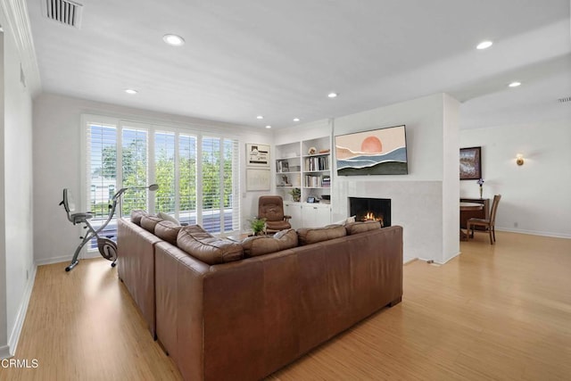 630 S Orange Grove Blvd Unit 5, Pasadena, CA 91105 - living room featuring light wood-type flooring, a premium fireplace, and recessed lighting
