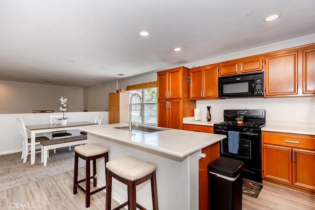 13015 New Hvn, Riverside, CA 92503 - kitchen with black appliances, light wood-style flooring, light countertops, and recessed lighting