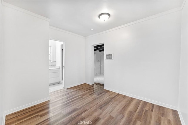 11749 Clarkman St, Santa Fe Springs, CA 90670 - unfurnished room with wood finished floors and ornamental molding