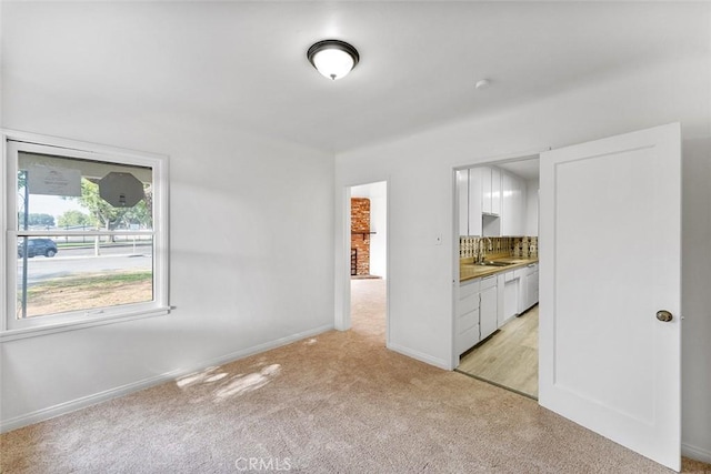 11749 Clarkman St, Santa Fe Springs, CA 90670 - unfurnished bedroom featuring light colored carpet and connected bathroom