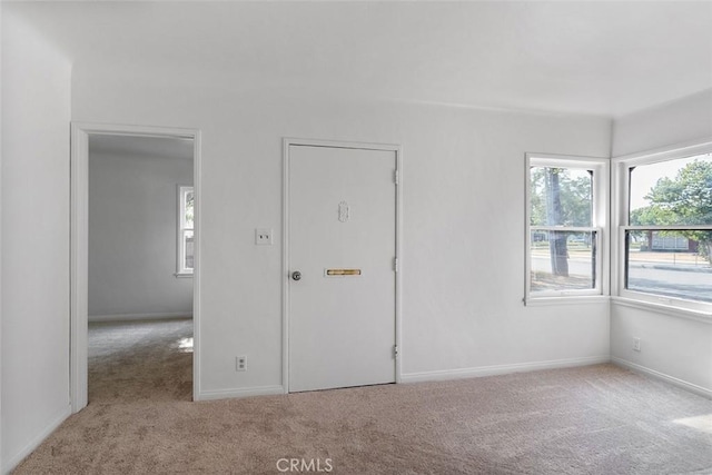 11749 Clarkman St, Santa Fe Springs, CA 90670 - carpeted empty room featuring plenty of natural light