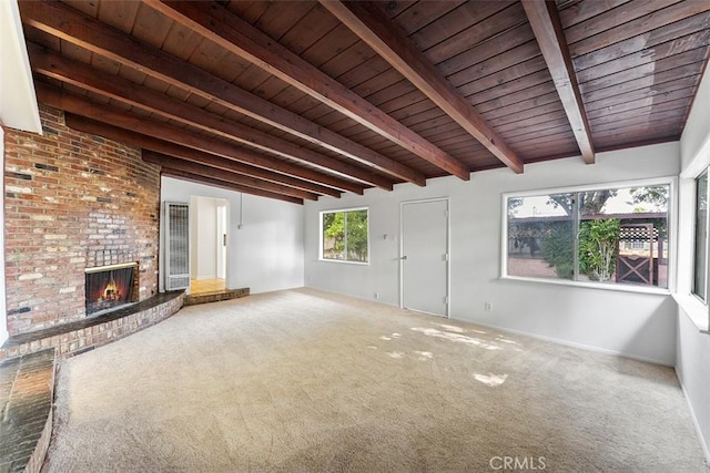 11749 Clarkman St, Santa Fe Springs, CA 90670 - unfurnished living room with a wood ceiling with exposed beams, carpet, and a brick fireplace