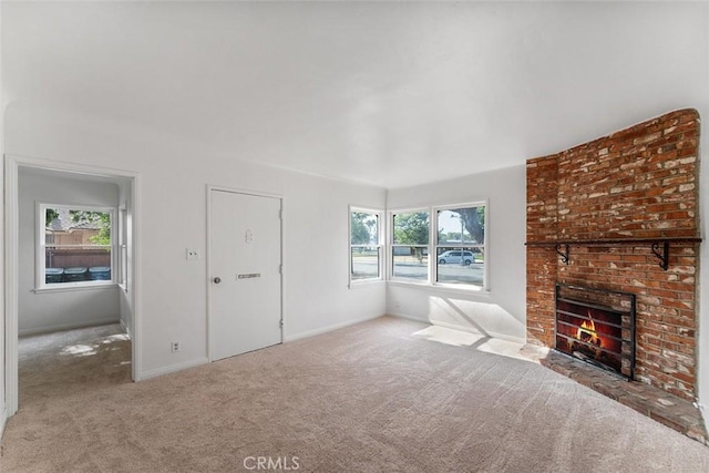 11749 Clarkman St, Santa Fe Springs, CA 90670 - unfurnished living room featuring carpet floors, plenty of natural light, and a fireplace
