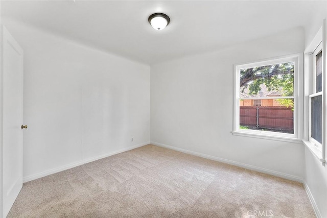 11749 Clarkman St, Santa Fe Springs, CA 90670 - carpeted spare room featuring baseboards