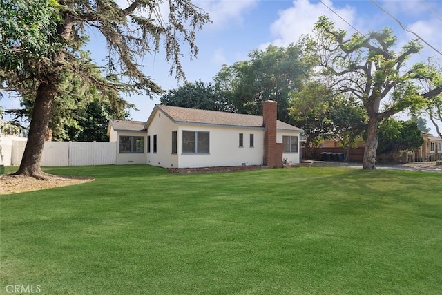 11749 Clarkman St, Santa Fe Springs, CA 90670 - rear view of property featuring a chimney and stucco siding