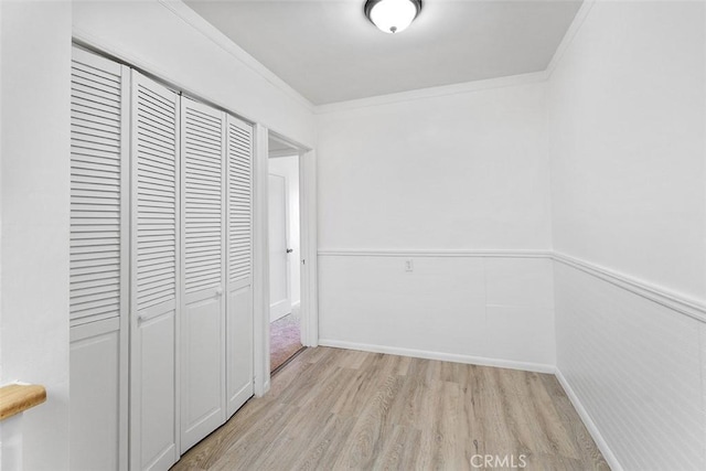 11749 Clarkman St, Santa Fe Springs, CA 90670 - hallway with light wood-type flooring and ornamental molding