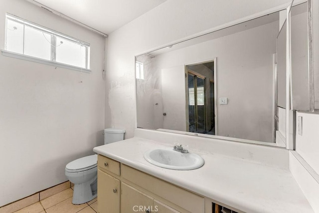 10527 S Wilton Pl, Los Angeles, CA 90047 - bathroom featuring tile patterned floors and vanity