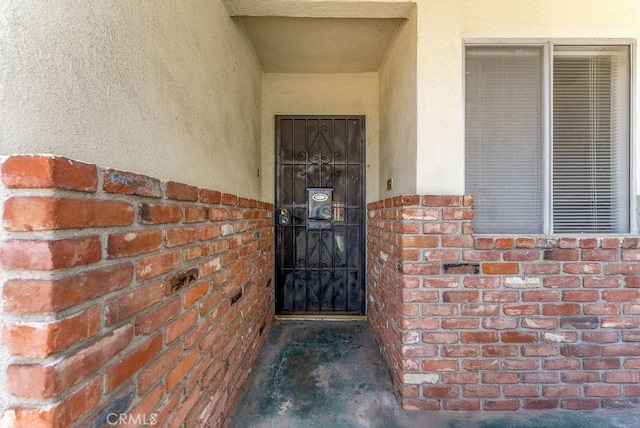 10527 S Wilton Pl, Los Angeles, CA 90047 - property entrance with stucco siding and brick siding