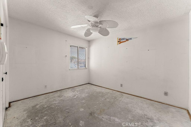 10527 S Wilton Pl, Los Angeles, CA 90047 - unfurnished room featuring concrete floors, a ceiling fan, and a textured ceiling