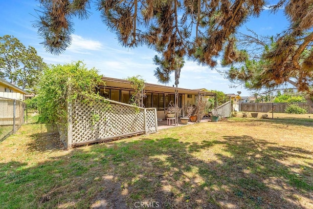 10527 S Wilton Pl, Los Angeles, CA 90047 - fenced backyard with a sunroom
