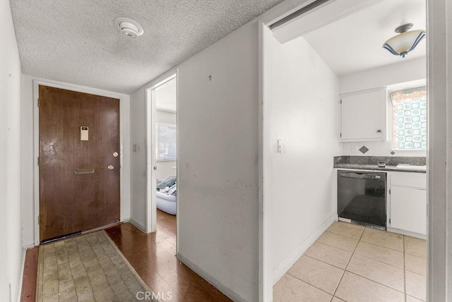10527 S Wilton Pl, Los Angeles, CA 90047 - entryway with a textured ceiling and light tile patterned floors