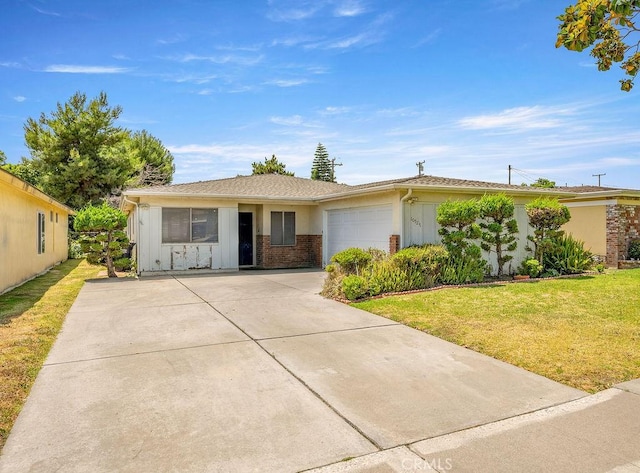10527 S Wilton Pl, Los Angeles, CA 90047 - ranch-style home with concrete driveway, a front yard, a garage, board and batten siding, and brick siding