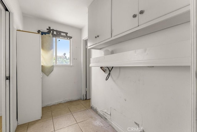 10527 S Wilton Pl, Los Angeles, CA 90047 - washroom featuring light tile patterned floors
