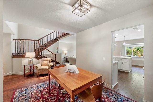 29411 Port Royal Way, Laguna Niguel, CA 92677 - dining space featuring dark wood finished floors, stairway, and a textured ceiling