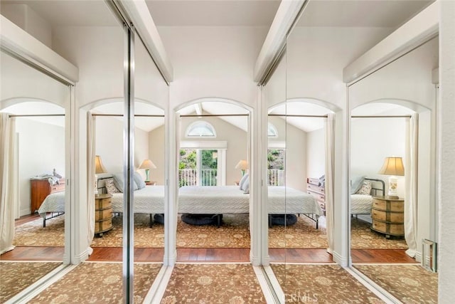 29411 Port Royal Way, Laguna Niguel, CA 92677 - bedroom with arched walkways, wood finished floors, and vaulted ceiling