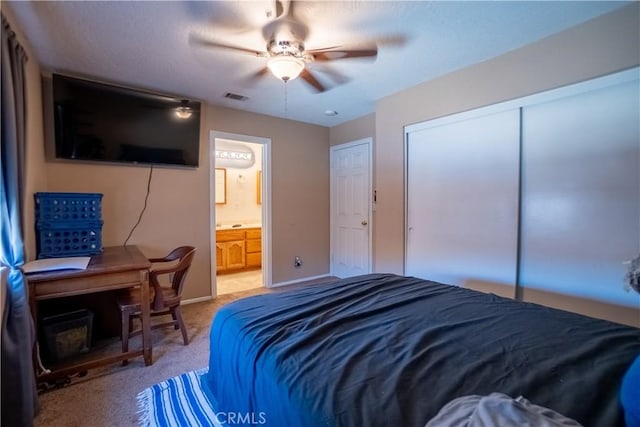 7681 Newhall Ave, Hesperia, CA 92345 - bedroom with a closet, ensuite bathroom, light carpet, and ceiling fan