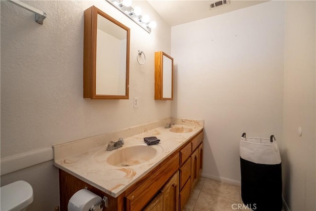 7681 Newhall Ave, Hesperia, CA 92345 - bathroom featuring double vanity and tile patterned flooring