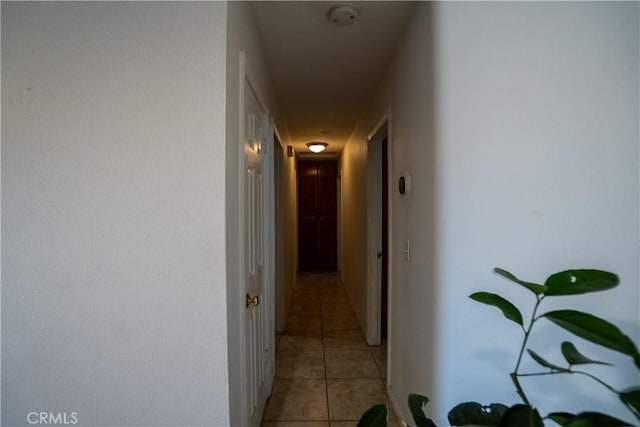7681 Newhall Ave, Hesperia, CA 92345 - corridor featuring light tile patterned floors