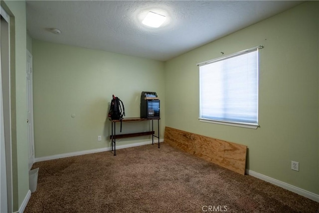 7681 Newhall Ave, Hesperia, CA 92345 - carpeted spare room with a smoke detector and a textured ceiling