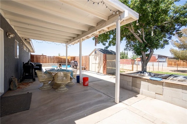 7681 Newhall Ave, Hesperia, CA 92345 - fenced backyard with a storage shed, a patio, and outdoor dining area